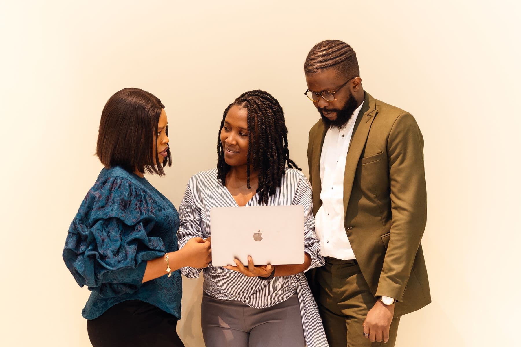 A business team planning work around a laptop